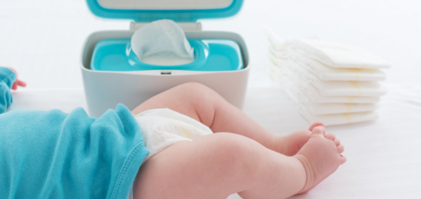 Baby next to wipes