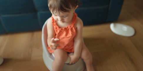 Child sitting on a potty
