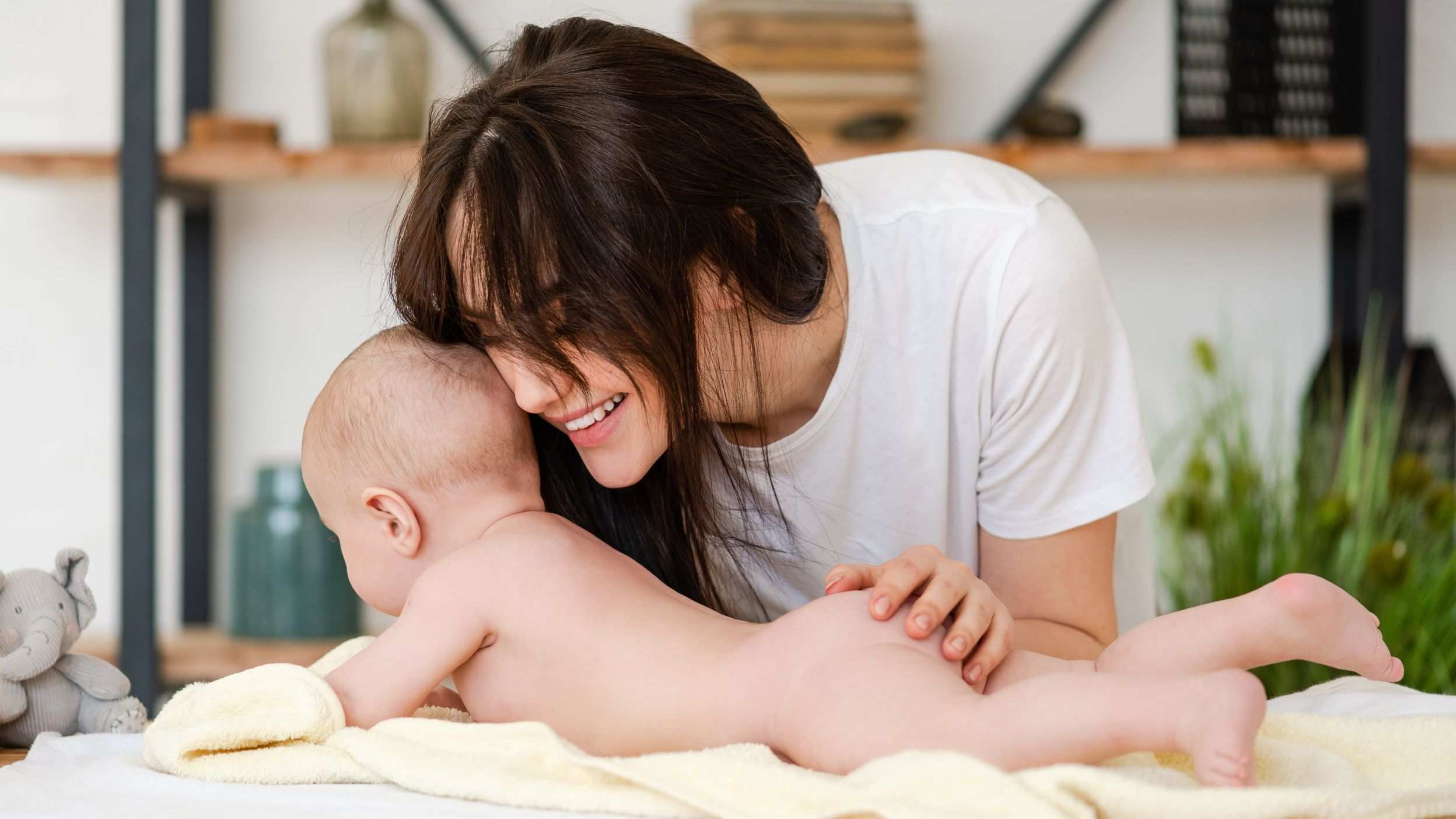 Smiling mom and baby