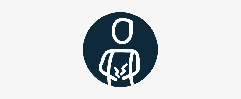 A person holding a sore tummy