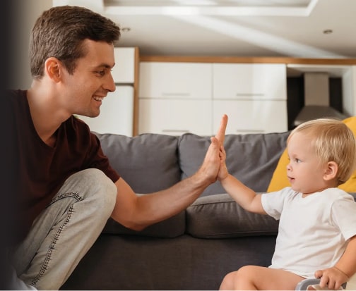 Dad giving his son a high-five
