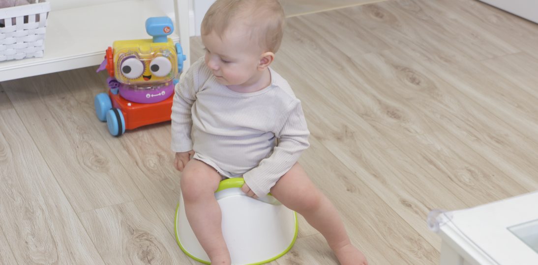Child sitting on a potty