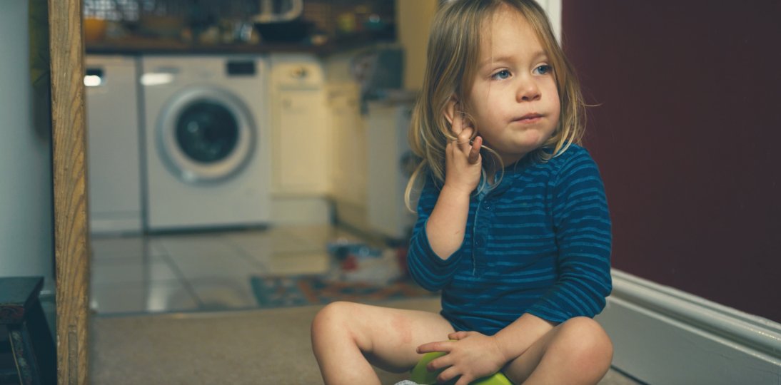 Child sitting on a potty